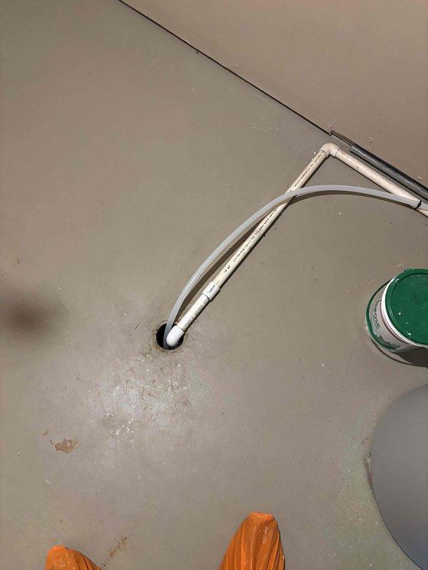 Responded to service call for water accumulation around furnace area. Upon inspection, identified issue with condensate drainage system. Examined condensate line routing and confirmed proper installation of flexible PVC drain line from air handler. Verified line was clear of obstructions and draining properly. Customer enrolled in preventative maintenance program to ensure continued system performance for unit installed in 2022.