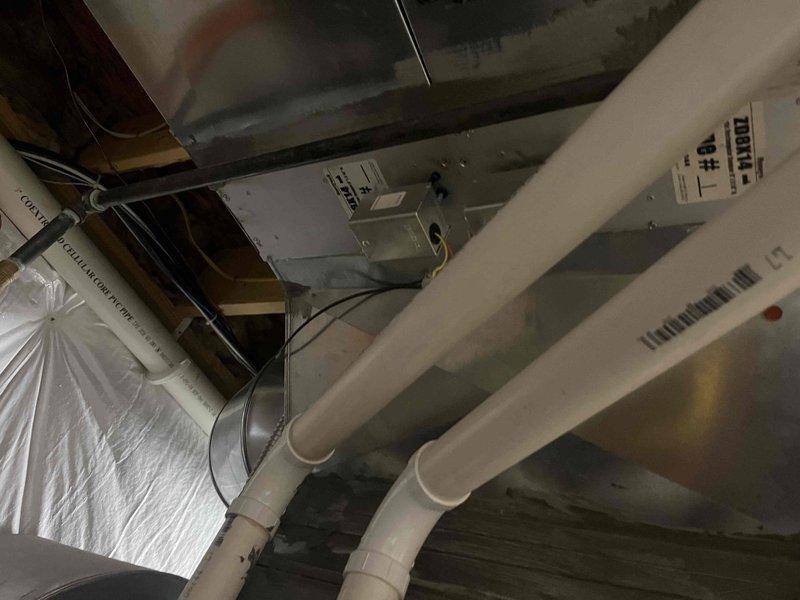 Responded to service call for zoning system malfunction causing overcooling in portions of the residence. Inspected zoning damper operation and associated controls using borescope inspection camera to assess damper positioning and mechanical function within ductwork system. Identified malfunctioning damper requiring adjustment or replacement. Provided customer with information regarding whole-home humidification options for the existing HVAC system. Noted inadequate ductwork distribution in one room with single supply register where dual supply configuration would be recommended for proper air delivery and temperature control.