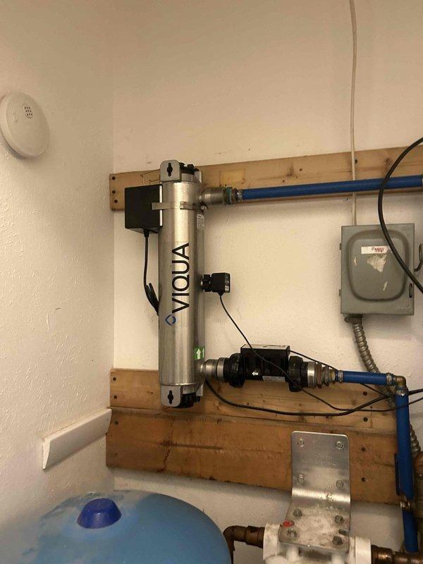Replaced UV lamp on VIQUA water treatment system following manufacturer maintenance procedures. Addressed dripping bathroom faucet located adjacent to water closet.