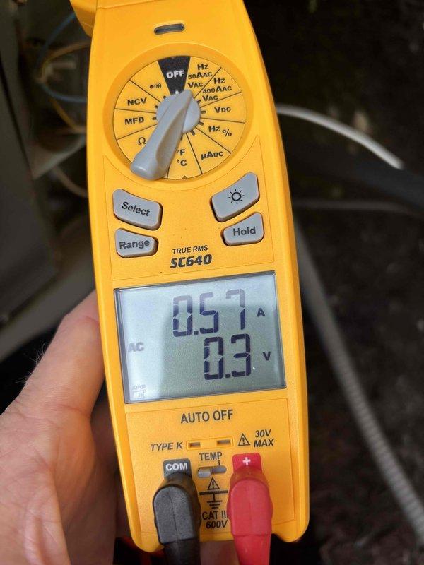 Completed comprehensive air conditioning tune-up and system evaluation on air handler unit. Performed electrical diagnostics using digital multimeter, measuring voltage and amperage readings to verify proper system operation and component performance. All measurements confirmed equipment operating within manufacturer specifications.