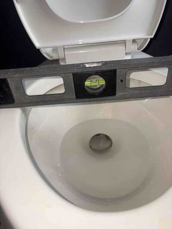 Responded to a toilet leak at the flange connection. Upon inspection, verified the toilet was not properly level and secured the fixture with new closet bolts and hardware to eliminate the leak at the base. Tested for proper seal and confirmed no further water discharge around the flange area.