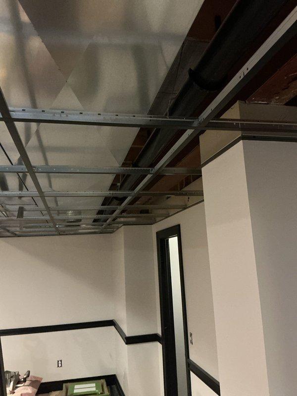Completed rough-in plumbing estimate for two owner-provided Saniflo pump installations in basement level. Assessed requirements for half bathroom and bar sink locations, including supply lines, discharge piping, and venting configurations for both units. Evaluated existing conditions of unfinished space with exposed ceiling joists and prepared preliminary scope for complete rough-in plumbing connections to support macerating pump systems.