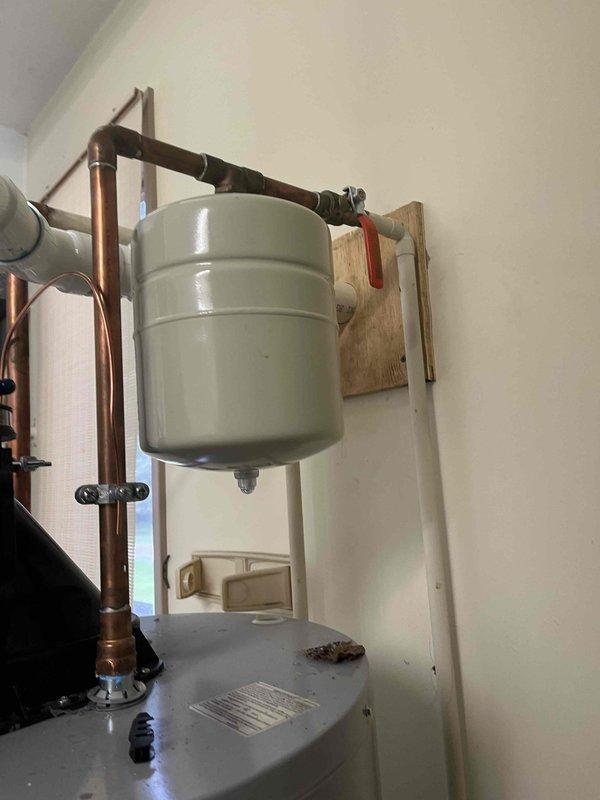 Responded to no hot water complaint at residential property. Upon arrival, inspected tanked water heater system including expansion tank, copper supply lines, and shut-off valves. Diagnosed faulty heating element preventing proper water temperature. Replaced defective heating element, tested thermostat functionality, and verified all connections secure. Flushed sediment buildup from tank bottom to improve heating efficiency and extend equipment lifespan. Confirmed system restoration with hot water delivery at appropriate temperature. Inspected expansion tank mounting and pressure relief valve for proper operation. All plumbing connections checked for leaks, system pressurized and cycled through complete heating cycle to ensure reliable performance before departure.