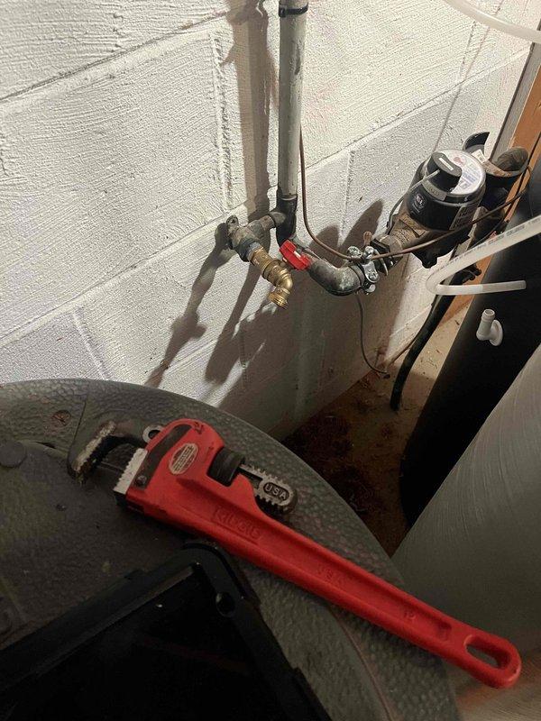 Responded to no hot water complaint at residential property. Upon arrival, inspected tanked water heater system including expansion tank, copper supply lines, and shut-off valves. Diagnosed faulty heating element preventing proper water temperature. Replaced defective heating element, tested thermostat functionality, and verified all connections secure. Flushed sediment buildup from tank bottom to improve heating efficiency and extend equipment lifespan. Confirmed system restoration with hot water delivery at appropriate temperature. Inspected expansion tank mounting and pressure relief valve for proper operation. All plumbing connections checked for leaks, system pressurized and cycled through complete heating cycle to ensure reliable performance before departure.