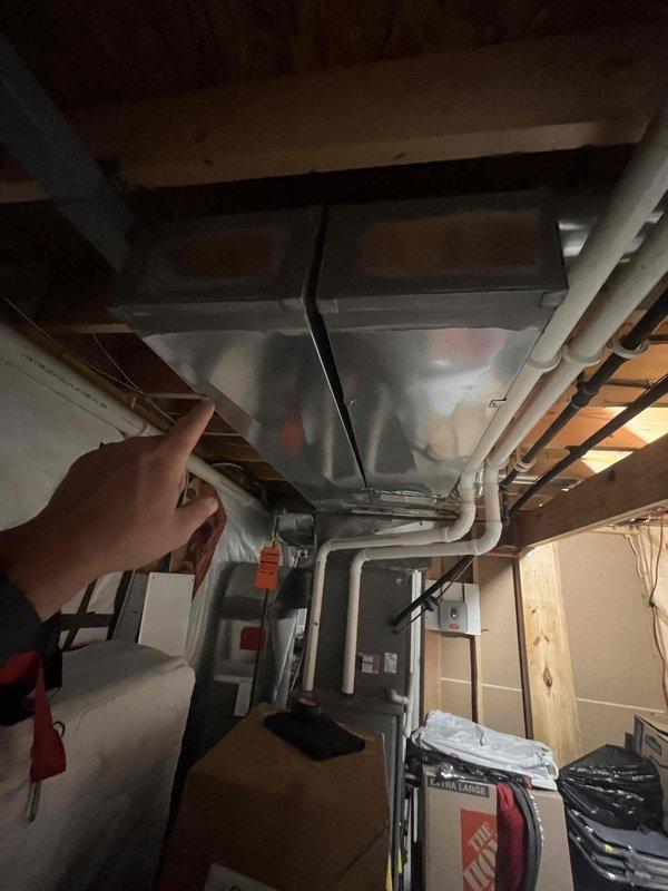 Evaluated whole home zoning system with malfunctioning damper causing overcooling in portions of the residence. Inspected HVAC ductwork and electrical panel, documented existing system configuration including inadequate ventilation in one room requiring additional supply vent. Provided estimate for zoning system repair and humidifier installation to address comfort concerns.