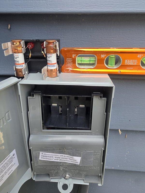 Completed installation of new air conditioning system and evaporator coil at residential property. Installed outdoor condensing unit with proper electrical disconnect and fusing, ensuring all connections meet code requirements and manufacturer specifications. Mounted and leveled exterior disconnect box on building exterior with appropriate copper fusing components. Inside the mechanical room, installed new evaporator coil integrated with existing furnace system, completing all refrigerant line connections and condensate drainage. Configured PVC venting system and verified proper clearances for all components. System was pressure tested, evacuated, and charged to manufacturer specifications. Performed operational testing to confirm proper system function, airflow, and temperature differential across the coil.
