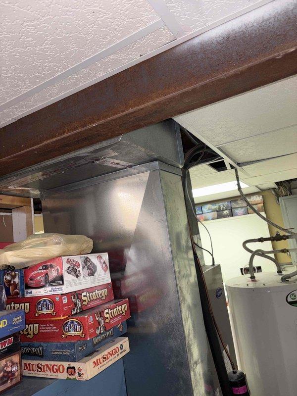 Responded to no cooling complaint with visible ice formation on heat pump system. Upon arrival, confirmed evaporator coils were frozen over with fan running but no cooling output. Instructed system shutdown to allow coils to thaw. Replaced dirty air filter and performed coil cleaning on air handler unit located in basement. System airflow restored and cooling operation resumed normally. Recommended ongoing preventative maintenance program to prevent future freezing issues and ensure optimal heat pump performance.