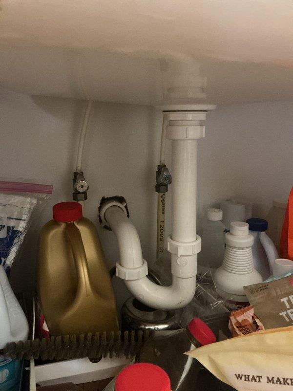 Completed club membership plumbing maintenance inspection of residential property. Performed visual assessment of bathroom sink faucet and under-sink plumbing connections, documenting chrome two-handle faucet fixture and LASCO PVC drain assembly with P-trap and shut-off valves in proper working condition. Discussed buy-one-get-one spigot promotion with customer and identified need to assess tankless water heater system for future service consideration while processing club membership renewal.
