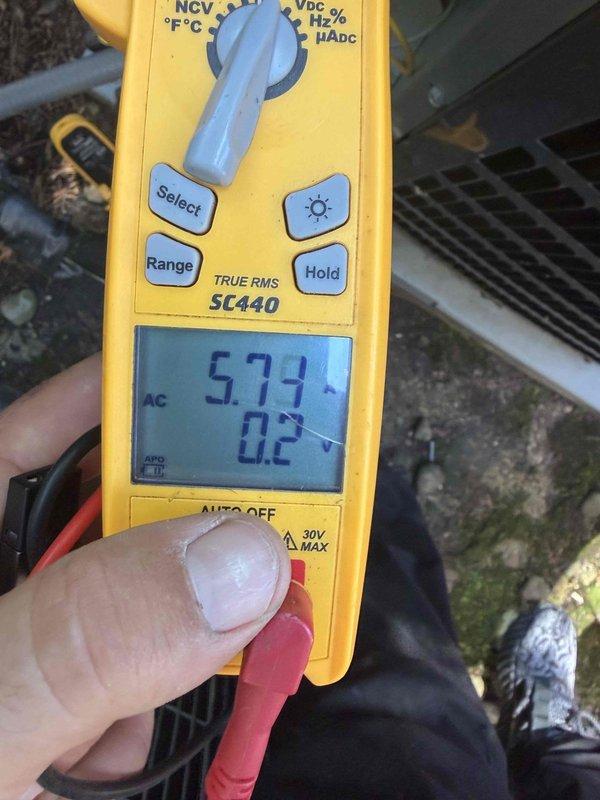 Completed cooling maintenance club visit on residential HVAC system. Performed comprehensive electrical diagnostics using digital multimeter, recording voltage readings of 573V AC and secondary measurement of 0.2, along with 48.61V measurement at condenser unit. Inspected outdoor condenser coil fins, which were found to be in good condition with minimal debris accumulation. All electrical parameters tested within normal operating ranges for the equipment.