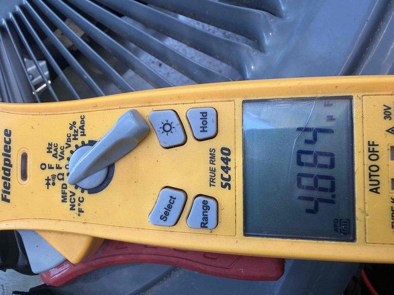 Completed cooling maintenance club visit on residential HVAC system. Performed comprehensive electrical diagnostics using digital multimeter, recording voltage readings of 573V AC and secondary measurement of 0.2, along with 48.61V measurement at condenser unit. Inspected outdoor condenser coil fins, which were found to be in good condition with minimal debris accumulation. All electrical parameters tested within normal operating ranges for the equipment.