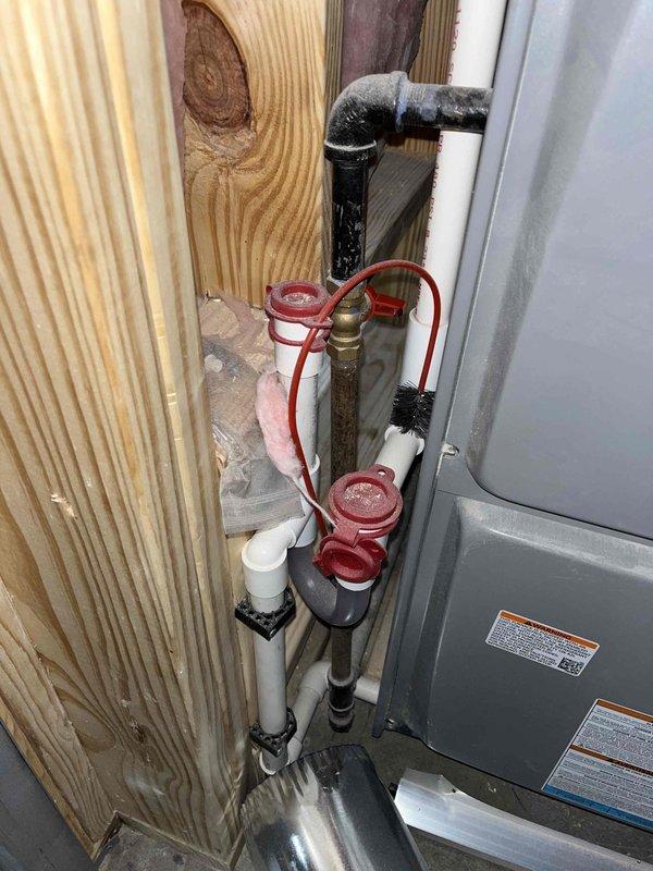 Responded to reported gas leak in basement near Navien combi boiler. Performed thorough inspection of gas piping, connections, and boiler components. Conducted pressure test on gas lines and verified all connections at service valves and appliance interface points. Inspected red-handled gas service valves, brass piping sections, and connections to HVAC system. All gas lines tested within acceptable pressure parameters with no measurable pressure drop detected. No active gas leaks identified at boiler connections, service valves, or associated piping. System deemed safe for continued operation.