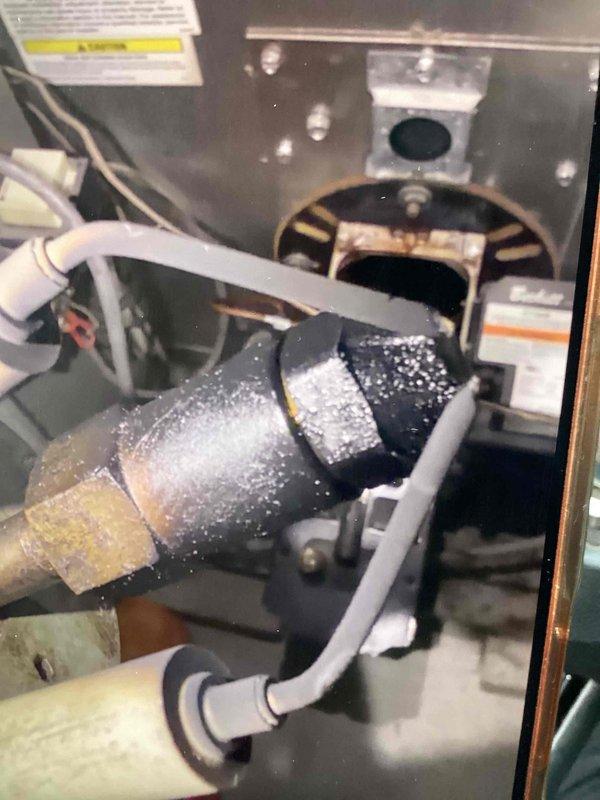 Completed preventative maintenance on oil-fired furnace system with military discount applied. Performed comprehensive inspection of electrical components, burner assembly, and blower motor system. Documented internal components including primary control, heating elements, and wiring connections, all found to be in serviceable condition. Noted abnormal frost accumulation on blower motor assembly indicating potential airflow restriction or system imbalance that will require monitoring. All safety controls tested and verified operational.