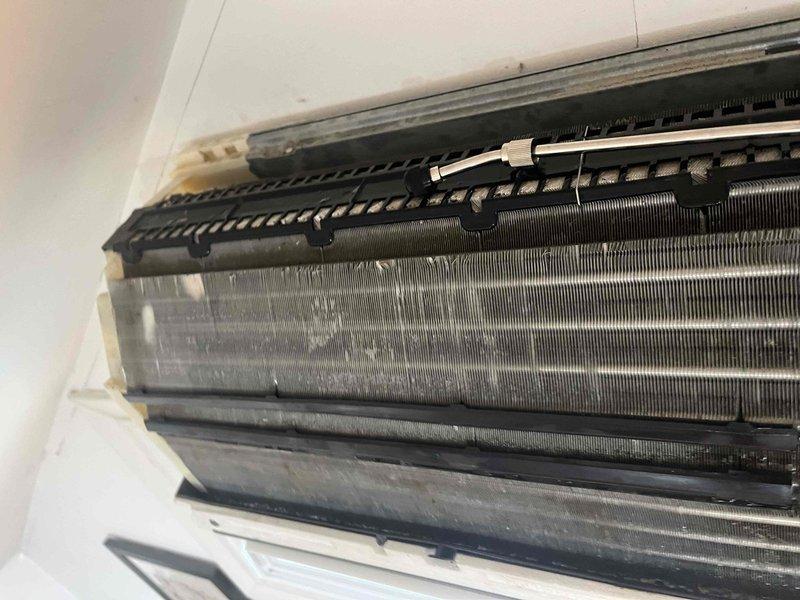 Completed comprehensive deep cleaning service on mini split system. Disassembled indoor unit to access evaporator coil and internal components, removed accumulated dust and debris from coil fins and fan assembly, cleaned control board enclosure and inspected electrical connections, then reassembled unit and verified proper operation.