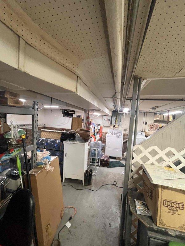 Conducted site assessment for ductwork installation to support garage-to-kitchen conversion. Evaluated existing HVAC system capacity and basement routing options for supply and return duct runs. Documented current equipment specifications and measured available clearances within mechanical cabinet and through proposed duct pathway. Identified optimal routing through basement ceiling space to new kitchen area, noting structural obstacles and required modifications to existing duct trunk line.