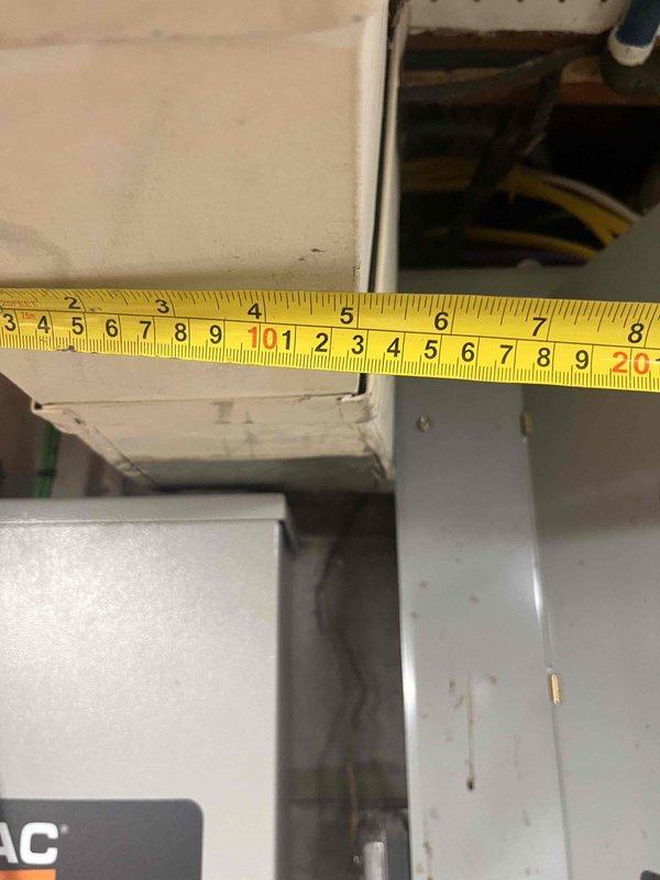 Conducted site assessment for ductwork installation to support garage-to-kitchen conversion. Evaluated existing HVAC system capacity and basement routing options for supply and return duct runs. Documented current equipment specifications and measured available clearances within mechanical cabinet and through proposed duct pathway. Identified optimal routing through basement ceiling space to new kitchen area, noting structural obstacles and required modifications to existing duct trunk line.