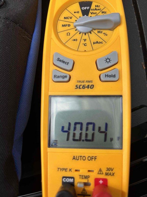 Completed cooling maintenance club visit on air handling unit. Inspected and documented air filter condition, noting accumulated dust and debris on pleated media requiring attention. Performed electrical diagnostics using digital multimeter, recording voltage reading of 40.04V to verify proper system operation and electrical component functionality.