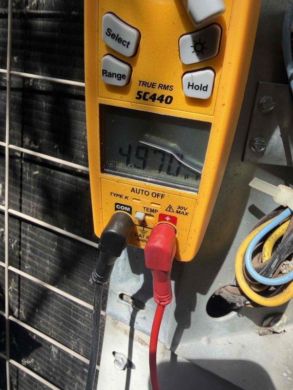 Performed cooling system inspection and tune-up on residential HVAC unit. Conducted comprehensive electrical diagnostics using digital multimeter to verify voltage readings and system performance parameters. All measurements recorded within acceptable operating ranges for continued safe operation.