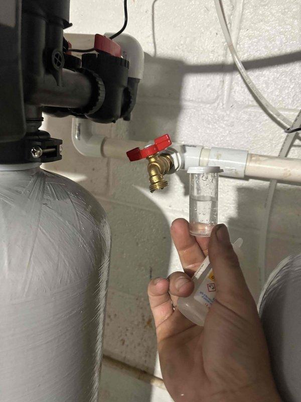 Returned to site to complete final adjustments and calibration of water treatment system installation. Performed water quality testing using digital meter to verify proper system operation and treatment levels. Fine-tuned system settings and confirmed all plumbing connections, shut-off valves, and pump assembly are functioning correctly with no leaks detected.