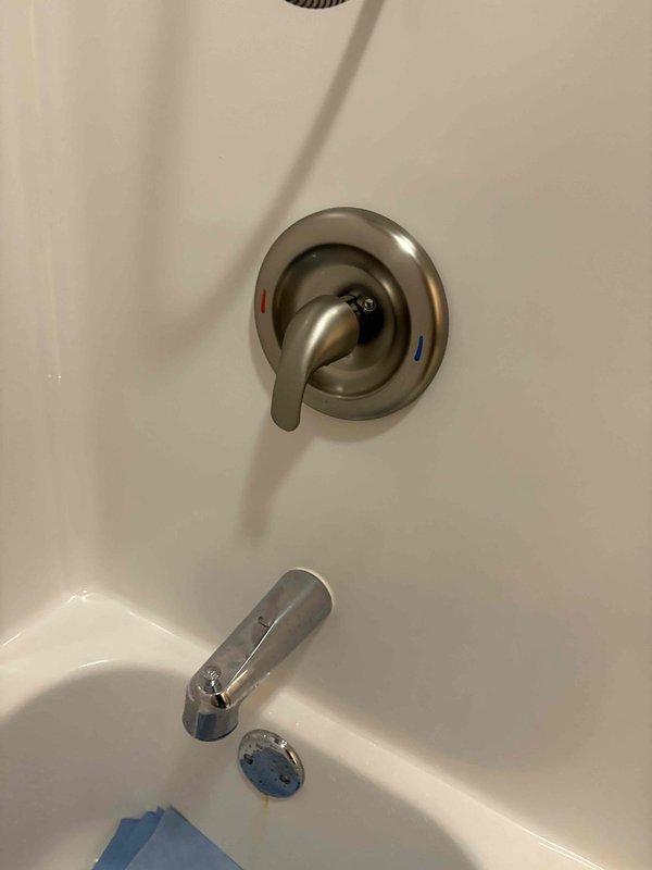 Responded to call for lack of hot water at shower while other fixtures maintained proper hot water supply. Inspected bathroom plumbing fixtures including single-handle shower/tub faucet control and tub spout. Diagnosed issue as faulty shower cartridge preventing hot water flow to shower head while allowing proper function at tub spout and other household fixtures. Replaced defective cartridge in shower valve assembly, restored full hot water function to shower, and verified proper temperature control operation.