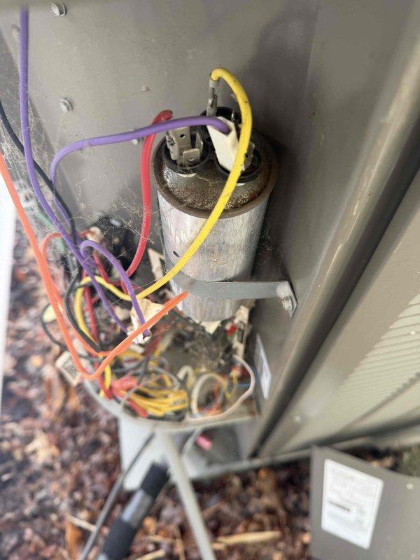 Responded to no cooling complaint on 2018 Lennox 3-ton heat pump with compressor buzzing on call for cooling. Upon inspection, diagnosed failed dual run capacitor showing visible deterioration and improper electrical values. Replaced defective capacitor with proper OEM-rated replacement, verified all electrical connections, tested system operation through complete cooling cycle, and confirmed compressor now starting and running properly with normal amperage draw.