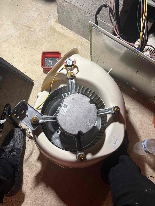 Completed blower motor warranty replacement on HVAC system. Removed failed motor assembly, installed new blower motor unit with mounting bracket, and reconnected all electrical connections and refrigerant lines to restore proper system operation.