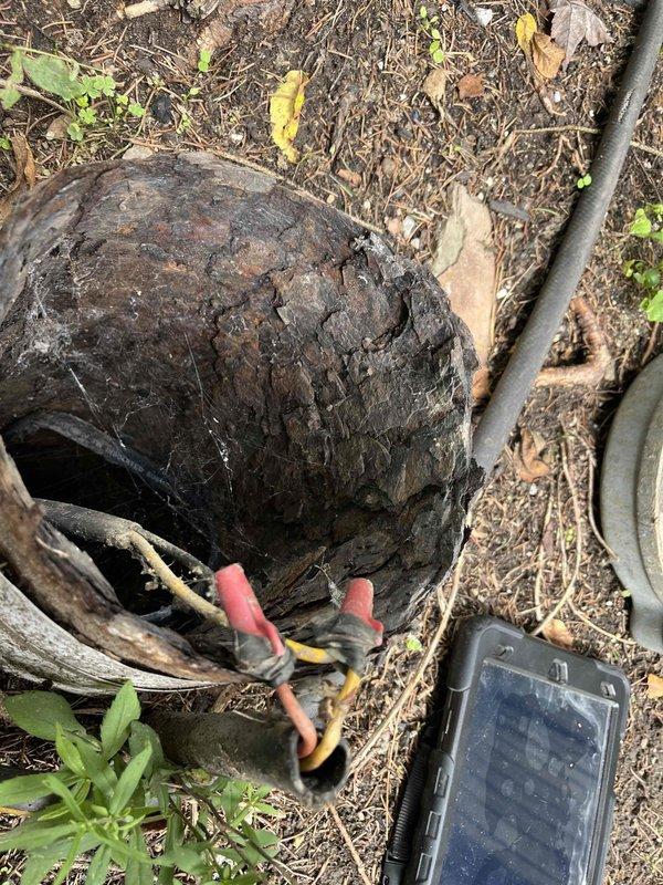 Responded to emergency no-water call and located well system with severely deteriorated well cap and compromised electrical connections. Inspected well shaft showing significant age-related deterioration with mineral deposits, algae growth, and structural concerns. Identified exposed and improperly protected wire splices with wire nuts inside deteriorated well cap assembly, creating potential safety hazard and contributing to system failure. Documented conditions of well infrastructure including damaged cap, exposed wiring connections, and overall system deterioration requiring immediate attention to restore water service and ensure safe operation.