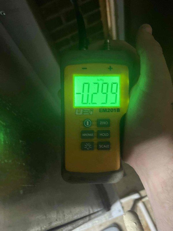 Responded to service call for AC system not turning on, unit previously installed in 2023. Performed diagnostic testing using digital manometer to measure system pressures in both the attic/mechanical space and at the air handler location. Measured static pressure readings of -0.299 and 0.509 inches water column to assess airflow and system performance. Verified equipment operation and completed pressure diagnostics to identify root cause of intermittent operation issue.