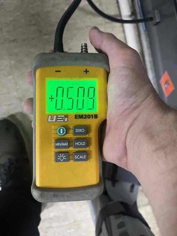 Responded to service call for AC system not turning on, unit previously installed in 2023. Performed diagnostic testing using digital manometer to measure system pressures in both the attic/mechanical space and at the air handler location. Measured static pressure readings of -0.299 and 0.509 inches water column to assess airflow and system performance. Verified equipment operation and completed pressure diagnostics to identify root cause of intermittent operation issue.