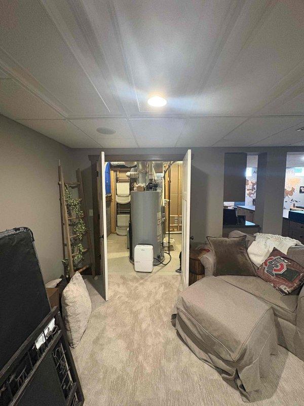 Conducted comprehensive assessment of existing 16-17 year old heating system and multiple HVAC units in residential basement installation. Evaluated current equipment configuration including furnace/air handler with extensive ductwork system, existing water heater, and multiple zone requirements for replacement consideration. Provided estimates for complete system replacement including multi-zone HVAC configuration, tankless water heater conversion, and water treatment system integration to meet homeowner's modernization objectives.