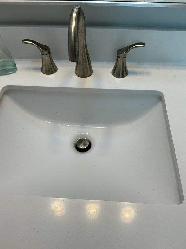 Responded to customer report of knocking sound emanating from tanked water heater in basement during hot water usage. Diagnosed issue as sediment buildup causing thermal expansion and contraction within tank, creating characteristic knocking or popping noises. Drained water heater completely to flush accumulated mineral deposits and sediment from tank bottom. Inspected temperature and pressure relief valve for proper operation and verified anode rod condition. Refilled tank and purged air from system. Tested hot water flow at multiple fixtures to confirm noise elimination and proper system operation.