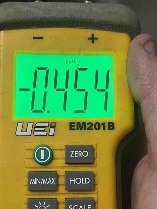 Returned to address warranty concern regarding blower motor and recurring freeze-up condition. Upon arrival, customer reported unit had frozen up again since previous visit and expressed concern about potential expansion valve failure. Performed diagnostic testing to identify root cause of freeze-up issue. Measured static pressure using digital manometer, recording -0.454 inches water column, indicating potential airflow restriction or undersized ductwork. Checked system voltage at 24.4 volts to verify proper control circuit operation and transformer output. Based on diagnostic findings and recurring freeze-up pattern, determined further investigation needed to rule out expansion valve malfunction, refrigerant charge issues, or airflow deficiencies contributing to evaporator coil icing. Documented system readings and conditions for warranty claim processing.