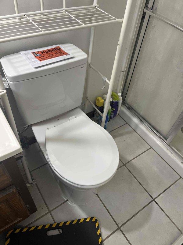 Responded to service call for toilet experiencing slow flushing and frequent clogging issues in compact bathroom. Assessed existing toilet condition and operational performance, documented fixture specifications and surrounding workspace constraints. Based on evaluation of recurring drainage problems and flush efficiency, recommended toilet replacement to resolve chronic performance issues.