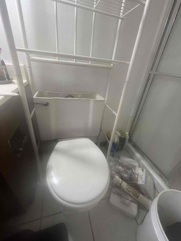 Responded to service call for toilet experiencing slow flushing and frequent clogging issues in compact bathroom. Assessed existing toilet condition and operational performance, documented fixture specifications and surrounding workspace constraints. Based on evaluation of recurring drainage problems and flush efficiency, recommended toilet replacement to resolve chronic performance issues.
