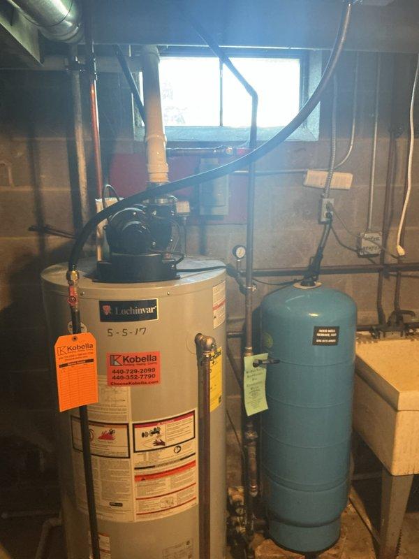 Provided estimate for installation of water line from barn to basement. Line will require trenching and burial to protect from freezing and meet code requirements. Assessed existing basement plumbing infrastructure including water heater, expansion tank, and water softener system to determine optimal connection point for new supply line.