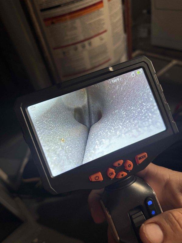 Responded to Error E9 fault code on attic-mounted mini split air handler. Performed diagnostic testing using digital multimeter and conducted internal inspection with borescope camera to identify system malfunction and verify component integrity.