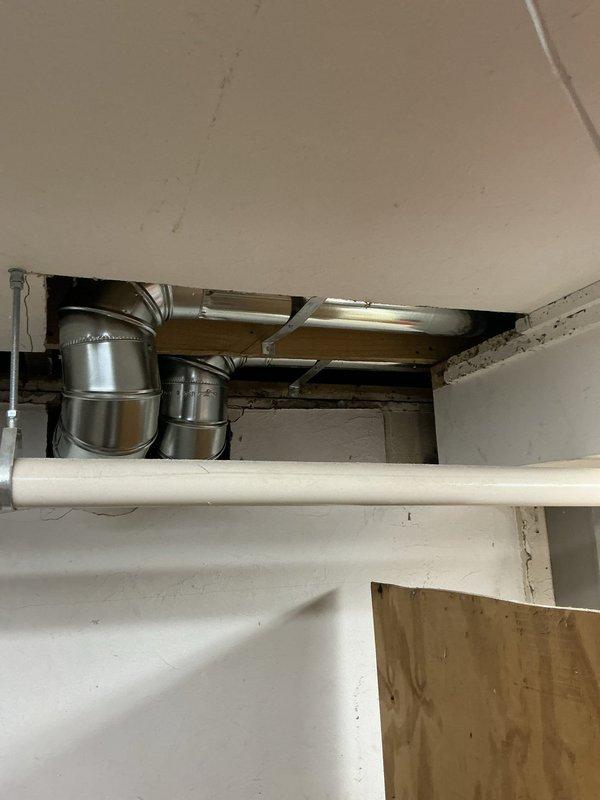 Completed ductwork installation in attic space as follow-up to previous sale. Installed black flexible ductwork with proper support hangers attached to ceiling joists, routed metallic transition ductwork through ceiling cavity with appropriate reducers and connecting joints, and installed fiberglass batt insulation between wall studs. All ductwork secured according to code requirements and system ready for HVAC connection.