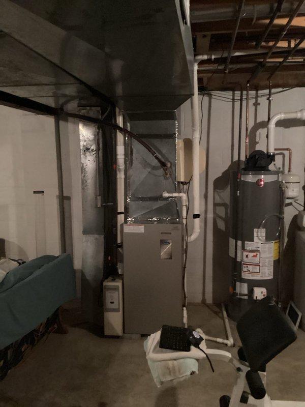 Responded to customer report of Carrier furnace making unusual noise that began during the spring season. Conducted comprehensive assessment of existing HVAC system located in basement mechanical room. Evaluated furnace condition, operational performance, and identified source of noise concern. Documented current equipment configuration including furnace unit, water heater, ductwork connections, and associated plumbing systems. Provided detailed estimate for complete furnace replacement to address noise issue and ensure reliable heating system performance. Photographed existing equipment layout and mechanical room conditions for replacement planning and customer records.