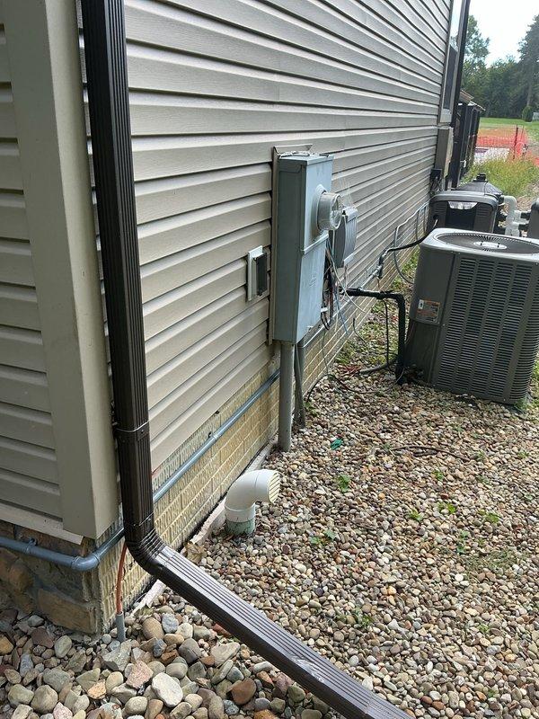 Completed gas line extension by teeing off the main supply line and running approximately 25-30 feet of pipe along the exterior wall to the HVAC unit. Installed new piping with appropriate fittings and connections to provide gas service to the equipment, ensuring proper support and code-compliant installation along the building's exterior.