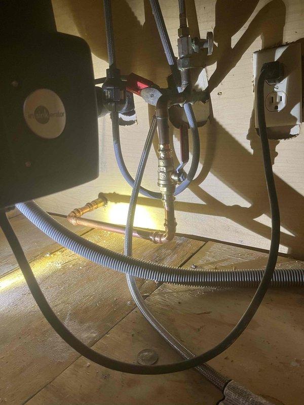 Replaced outdoor hose bib that had seized threads preventing hose removal. Removed the fused spigot assembly from the exterior wall, installed new brass hose bib with proper threading, and verified operation with no leaks detected upon testing.