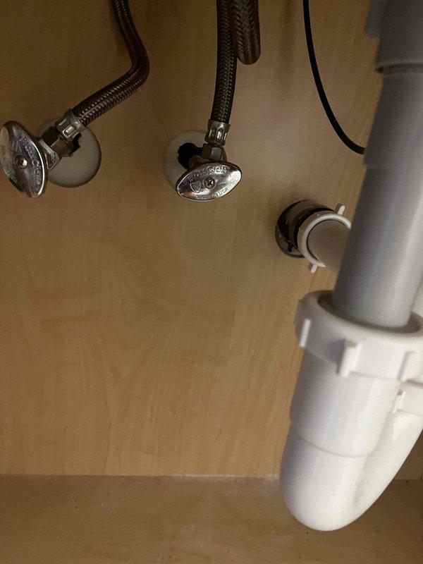 Installed two customer-supplied bathroom faucets with complete connection to existing water supply lines and drain assemblies. All fixtures were properly secured, tested for leaks, and verified for proper operation with chrome flexible supply lines connected to angle stop valves and P-trap drain configuration confirmed functional.