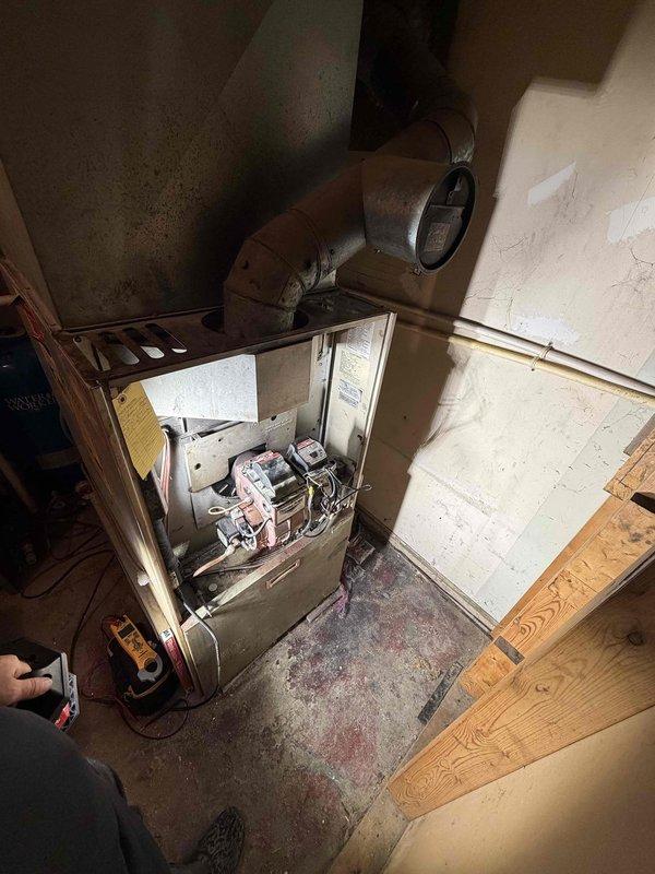 Responded to service call for furnace evaluation. Performed visual inspection of existing heating system located in utility space. Unit assessed for operational status and overall condition. Customer inquired about system replacement options and financing availability due to concerns about equipment age and performance. Documented current system configuration with heating-only setup, no cooling components present.