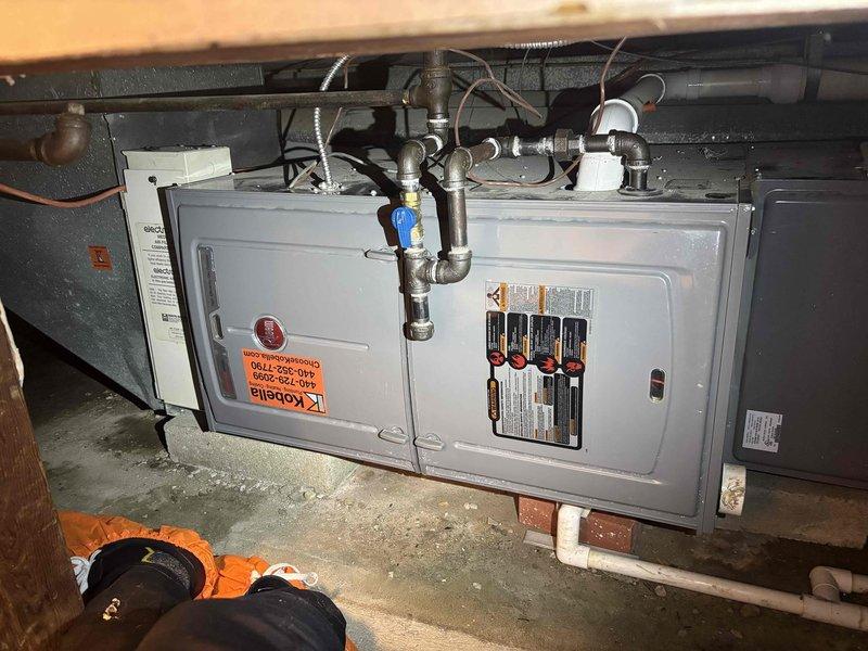 Responded to service call for furnace producing whistling noise. Upon inspection, identified excessive condensation on supply ductwork in crawl space and verified HVAC system operation. Documented equipment conditions with photos showing moisture accumulation on insulated ductwork, which can contribute to airflow restrictions and unusual sounds when air passes through affected areas.