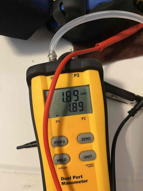 Completed heating maintenance club visit on air handler system using R-410A refrigerant. Performed standard system inspection and recorded service visit on equipment tag. Verified gas pressure readings at 1.89 inches of water column using dual port manometer, confirming proper combustion air pressure within manufacturer specifications.