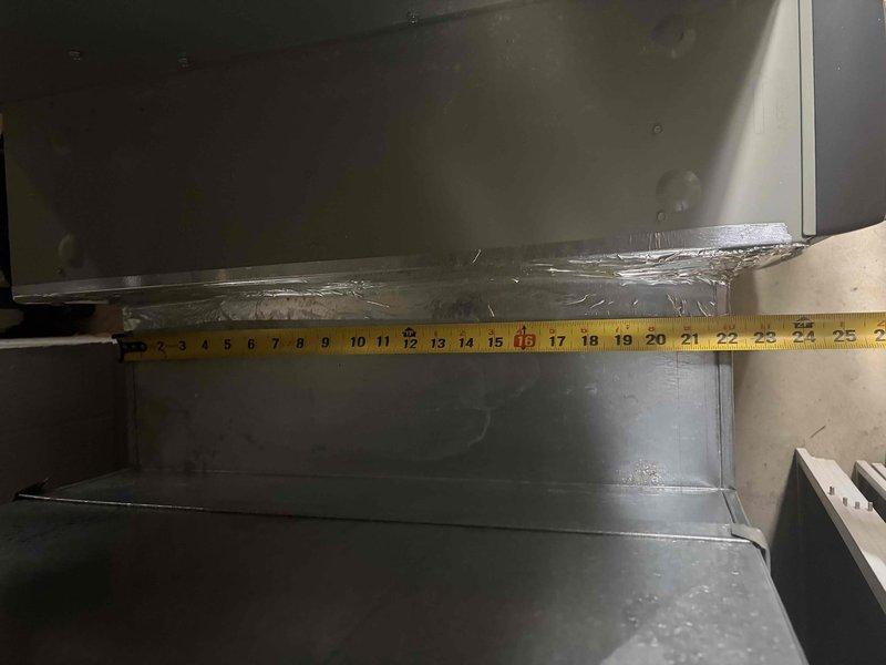 Responded to no cooling complaint on 8-year-old R41OA mini split system. Found indoor unit powered on with indicator light functioning but fan motor not operating. Performed diagnostic measurements of interior components and documented clearances within the air handler assembly. System requires fan motor replacement or further electrical troubleshooting to restore cooling operation.