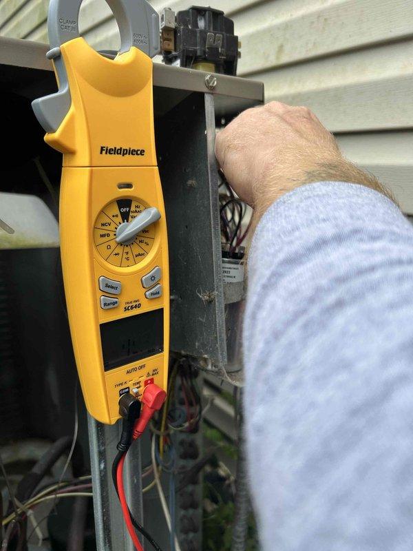 Responded to no cooling call where air conditioning system was tripping the breaker. Upon arrival, performed electrical diagnostics using digital multimeter to test voltage and amperage at the outdoor unit. Replaced faulty contactor and failed capacitor which were causing excessive current draw and breaker trips. Verified thermostat display was functioning properly. Tested system operation after repairs and confirmed unit running within normal electrical parameters without tripping breaker.