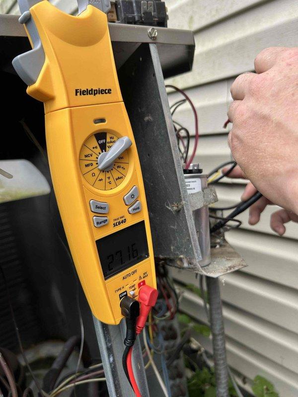 Responded to no cooling call where air conditioning system was tripping the breaker. Upon arrival, performed electrical diagnostics using digital multimeter to test voltage and amperage at the outdoor unit. Replaced faulty contactor and failed capacitor which were causing excessive current draw and breaker trips. Verified thermostat display was functioning properly. Tested system operation after repairs and confirmed unit running within normal electrical parameters without tripping breaker.