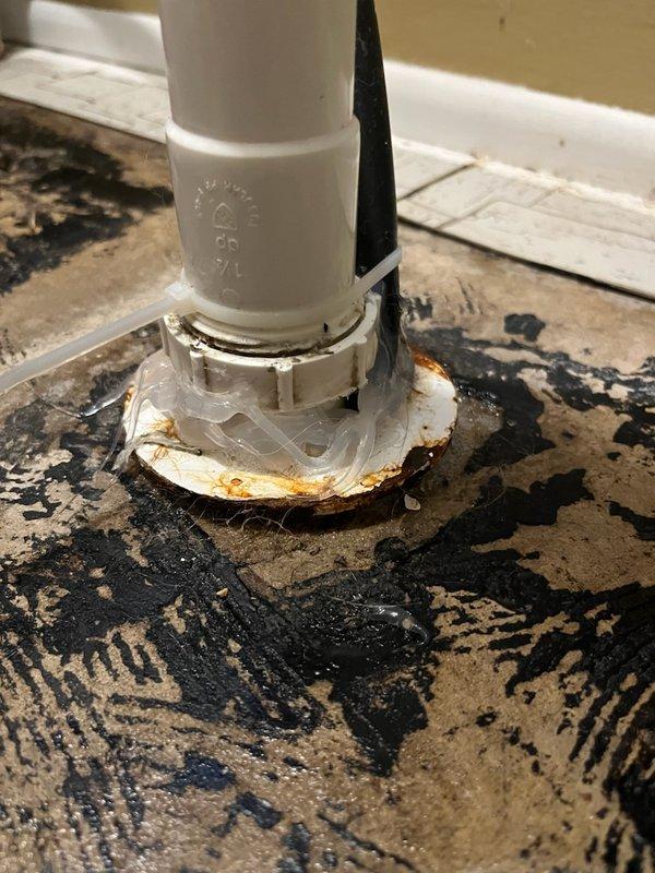 Responded to callback for possible leak at utility sink pipe following recent service. Upon inspection, discovered insufficient silicone sealant application around faucet base allowing water infiltration. Removed existing inadequate sealant, thoroughly cleaned and dried mounting surface, and properly resealed faucet base with appropriate silicone application to prevent future leakage. Verified no active leaks present and confirmed proper seal integrity.