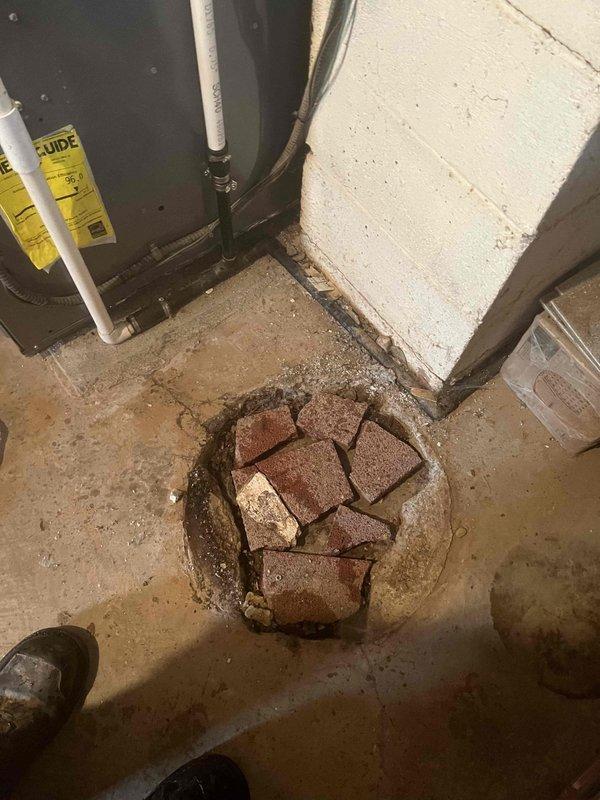 Responded to service call for high water consumption with no visible leaks. Conducted thorough inspection of plumbing system including water heater examination as requested. Investigated basement utility area and floor drain for potential hidden leaks or water infiltration issues. Documented conditions of drainage system and surrounding areas showing evidence of moisture concerns. Completed diagnostic assessment to identify source of elevated water usage.