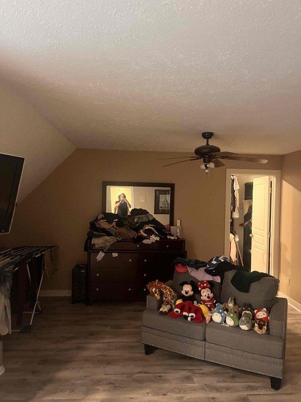 Conducted on-site assessment for mini split HVAC system installation in upper-level bedroom with sloped ceiling and adjacent closet space. Evaluated room layout, ceiling configuration, electrical requirements, and optimal placement for indoor air handler unit to ensure proper heating and cooling coverage in attic-style living area.