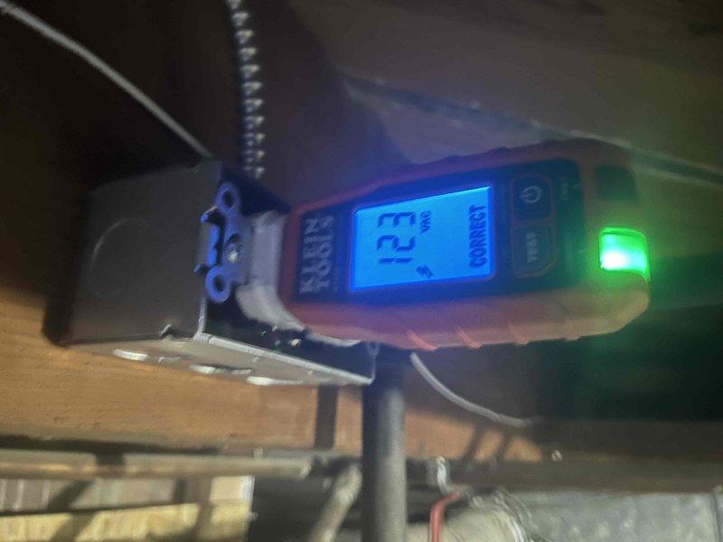 Responded to callback for non-functional tankless water heater with unresponsive power button. Upon arrival, performed diagnostic testing using digital moisture/humidity meter in attic space where unit is installed, recording reading of 72% which indicated elevated humidity levels near equipment. Inspected X3 Technology control panel and found display showing error code 18:88. Tested all control panel functions including pump, temperature adjustment, settings, timer, and power button. Determined control board was experiencing power delivery issues likely related to environmental moisture exposure in attic installation location. Documented equipment conditions and diagnostic readings with photos for warranty and follow-up purposes. Contacted dispatch to coordinate next steps for control board replacement or further electrical diagnostics.